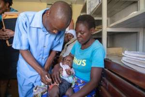 child getting malaria vaccine