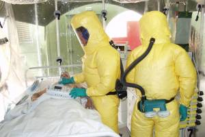 ebola patient being treated in an isolation tent
