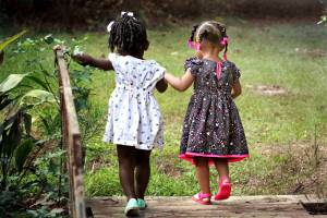 young girls holding hands
