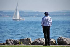 old man looking at the lake