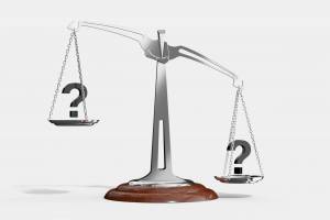 scales of justice with questions