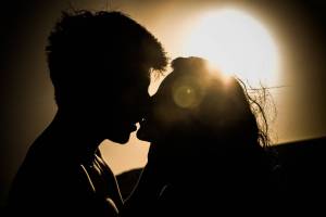 sunset couple kissing