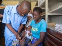 child getting malaria vaccine