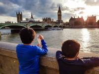 two young boys looking over the Thames river